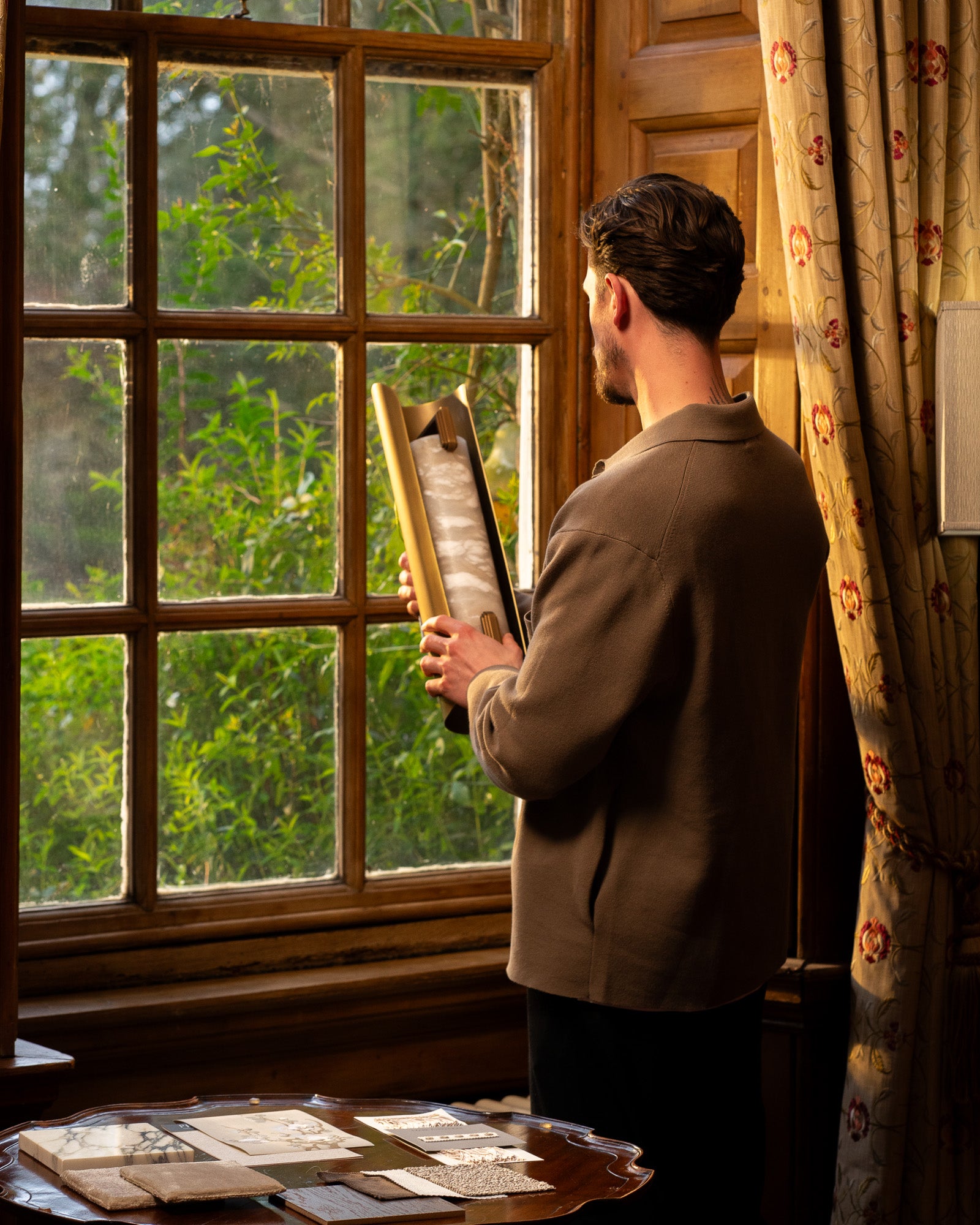 Interior designer reviewing material samples and finishes during the design development phase