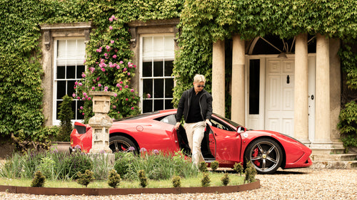 Private client arriving at a luxury residence in a Ferrari 458 Speciale as part of a Harper Charles lifestyle campaign