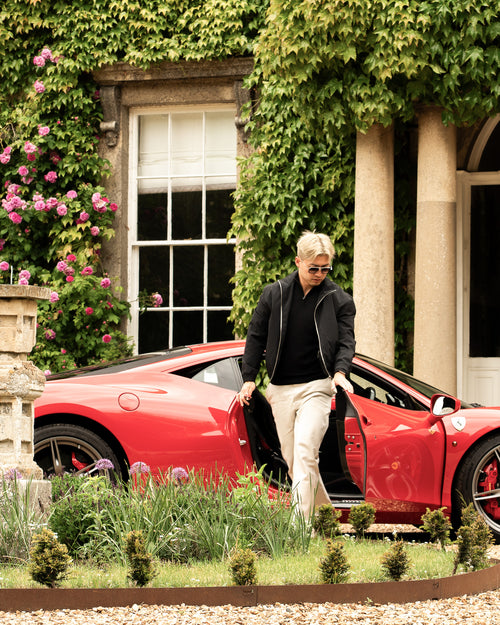 Private client arriving at a luxury residence in a Ferrari 458 Speciale for a Harper Charles campaign