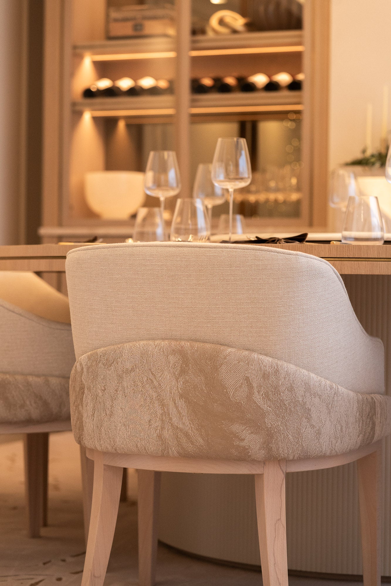 Detail of upholstered dining chair within a bespoke dining room interior.