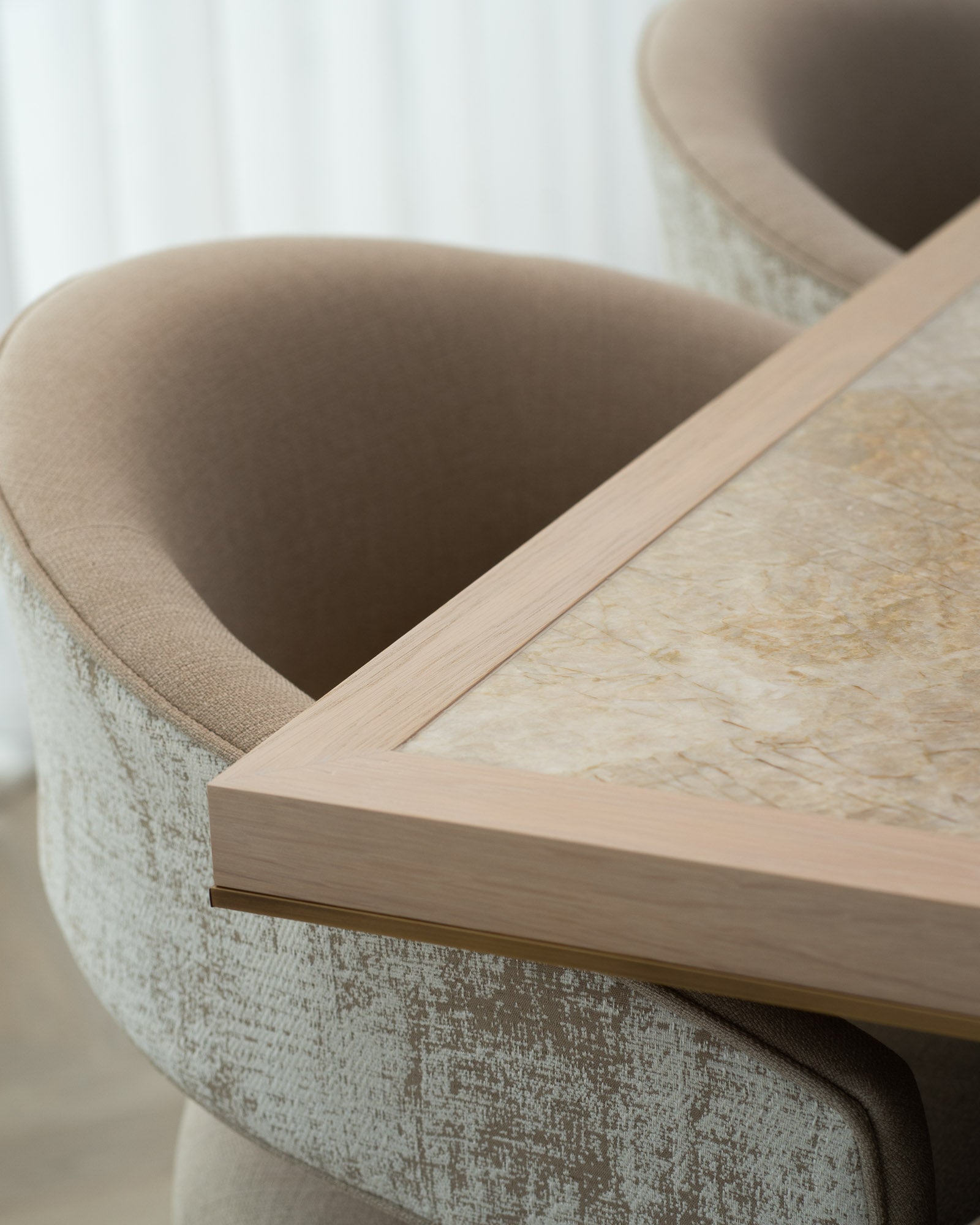 Detail of a bespoke dining table with upholstered dining chair and stone inset top.