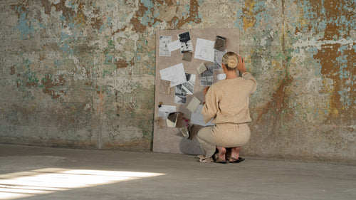 Interior designer curating materials and concepts during the design development process