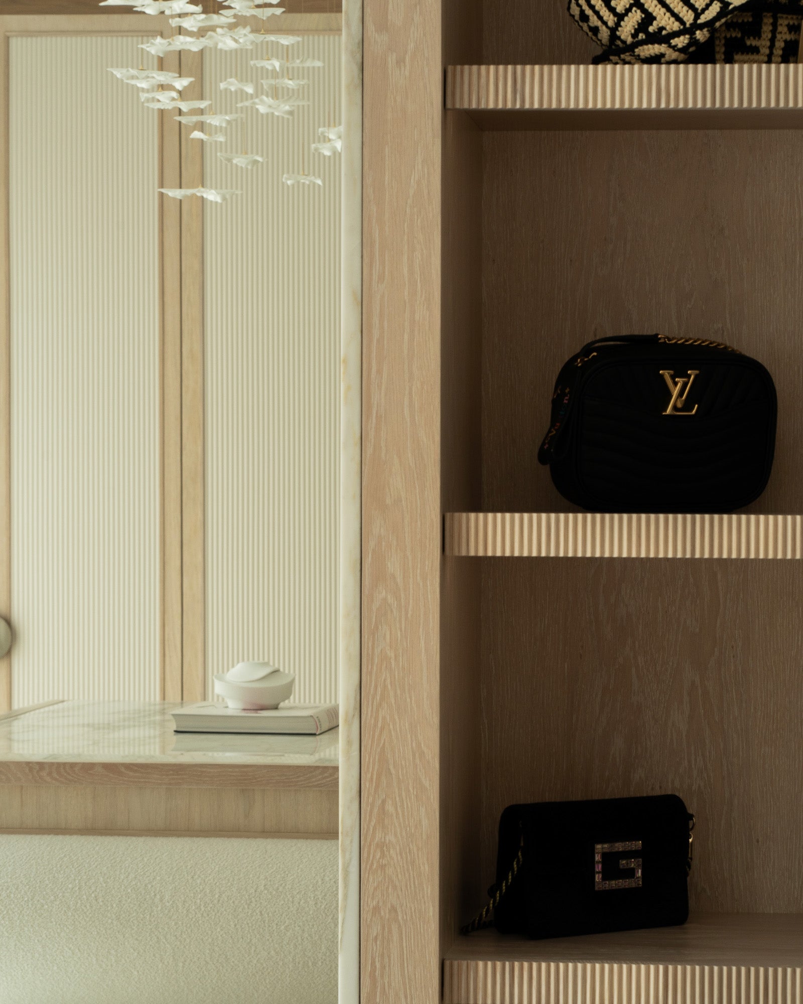 Bespoke oak cabinetry with integrated shelving and concealed storage.