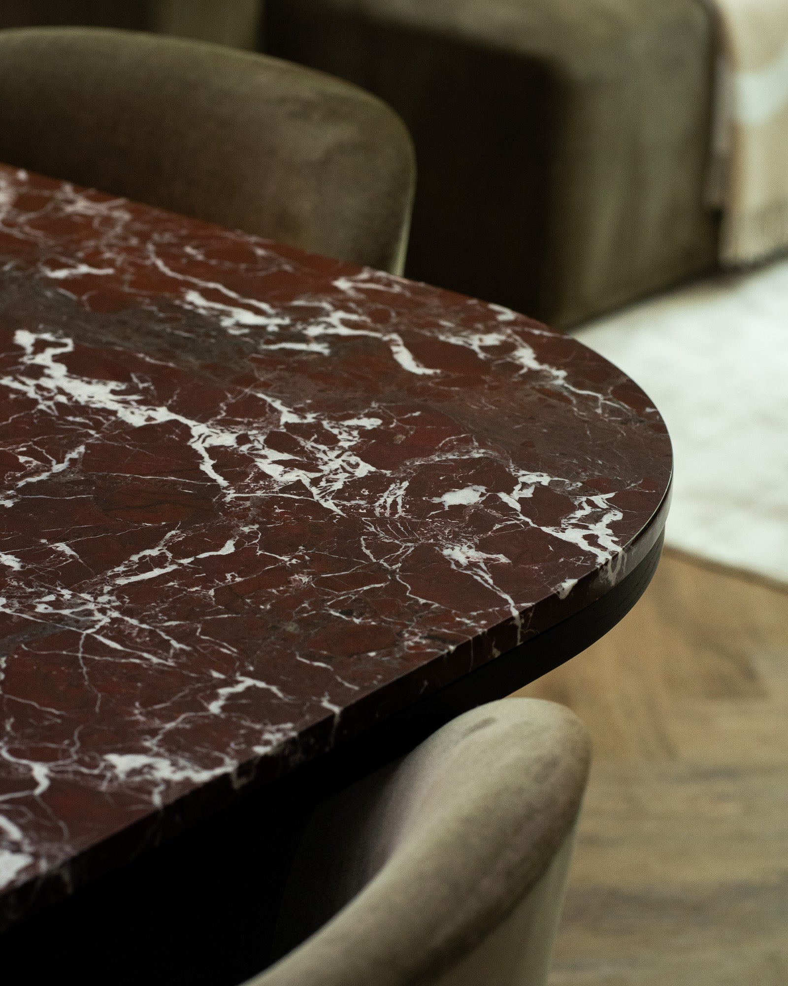 Detail of Rosso Levanto marble dining table within The Sevenoaks Residence