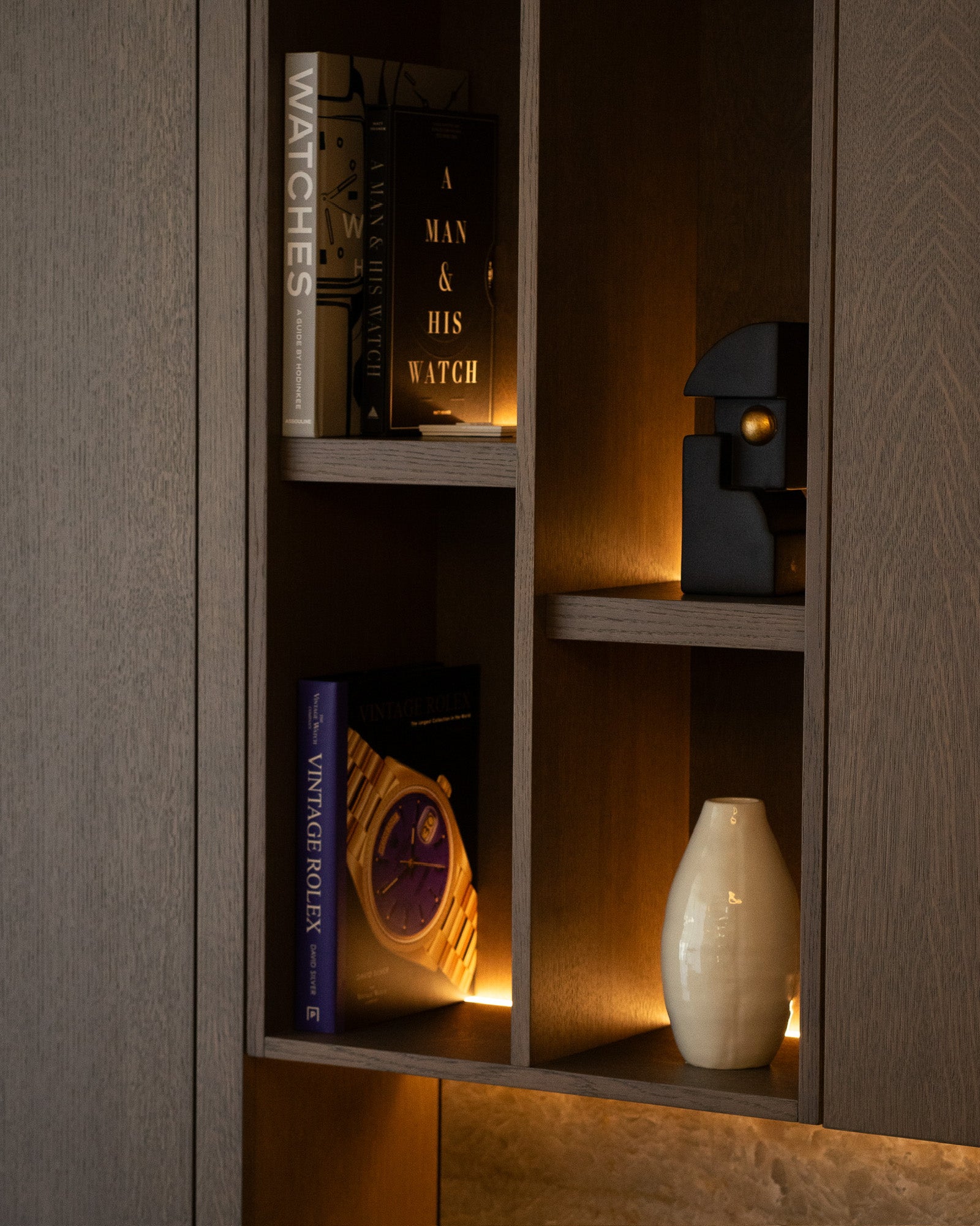 Bespoke illuminated shelving with decorative styling and integrated lighting at The Sevenoaks Residence
